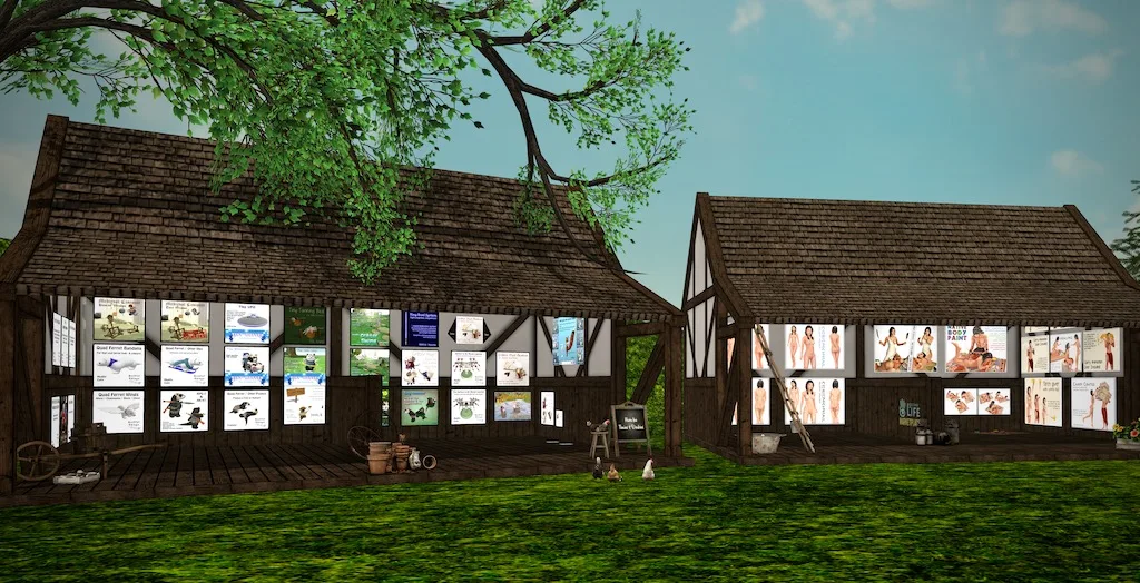 Two timber-framed barns in Second Life with product boards along the walls, on grass under a tree.